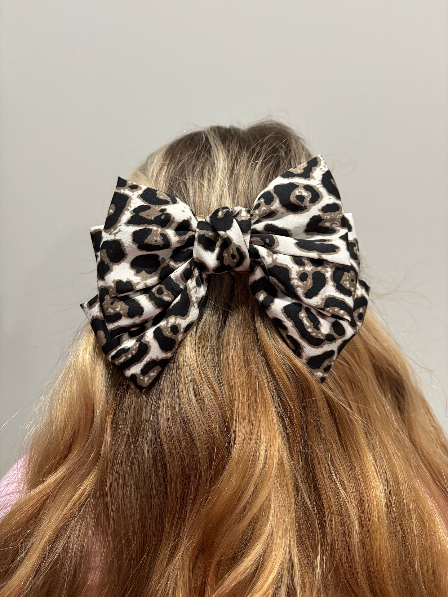 Animal print closed clasp bow